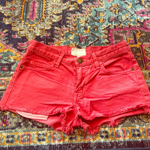 red distressed jean shorts